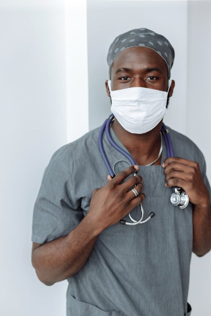 a man wearing a mask and scrubs